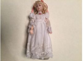 Porcelain girl with white coton dress and lace