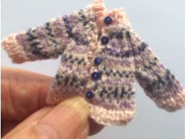 Miniature cardigan hand knitted