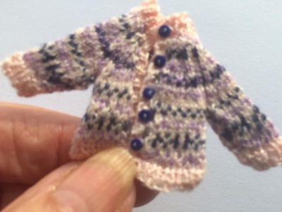 Miniature cardigan hand knitted