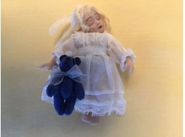 Porcelain sleeping doll