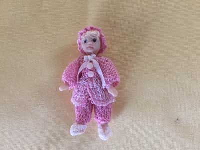 Porcelain Dolls doll with knitted outfit