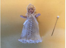Doll's doll in christening dress